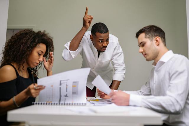 three people arguing